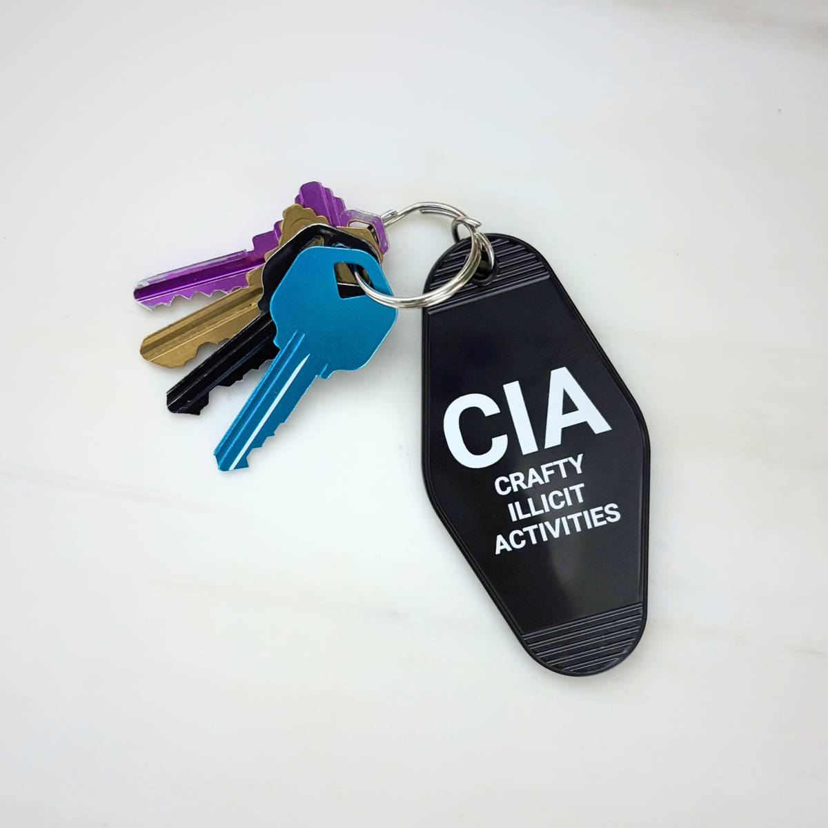 Crafty Illicit Activities Motel Style Keychain in Black