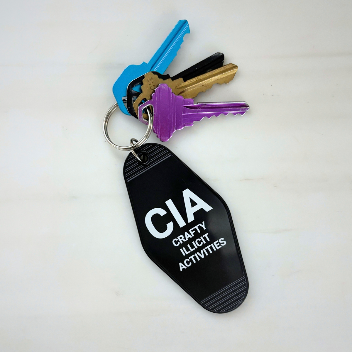 Crafty Illicit Activities Motel Style Keychain in Black