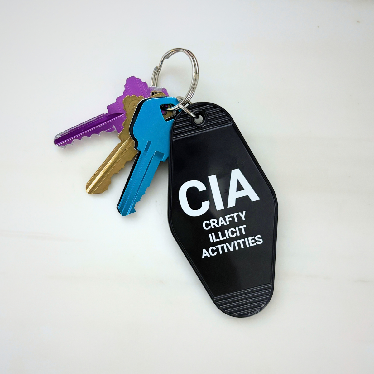 Crafty Illicit Activities Motel Style Keychain in Black