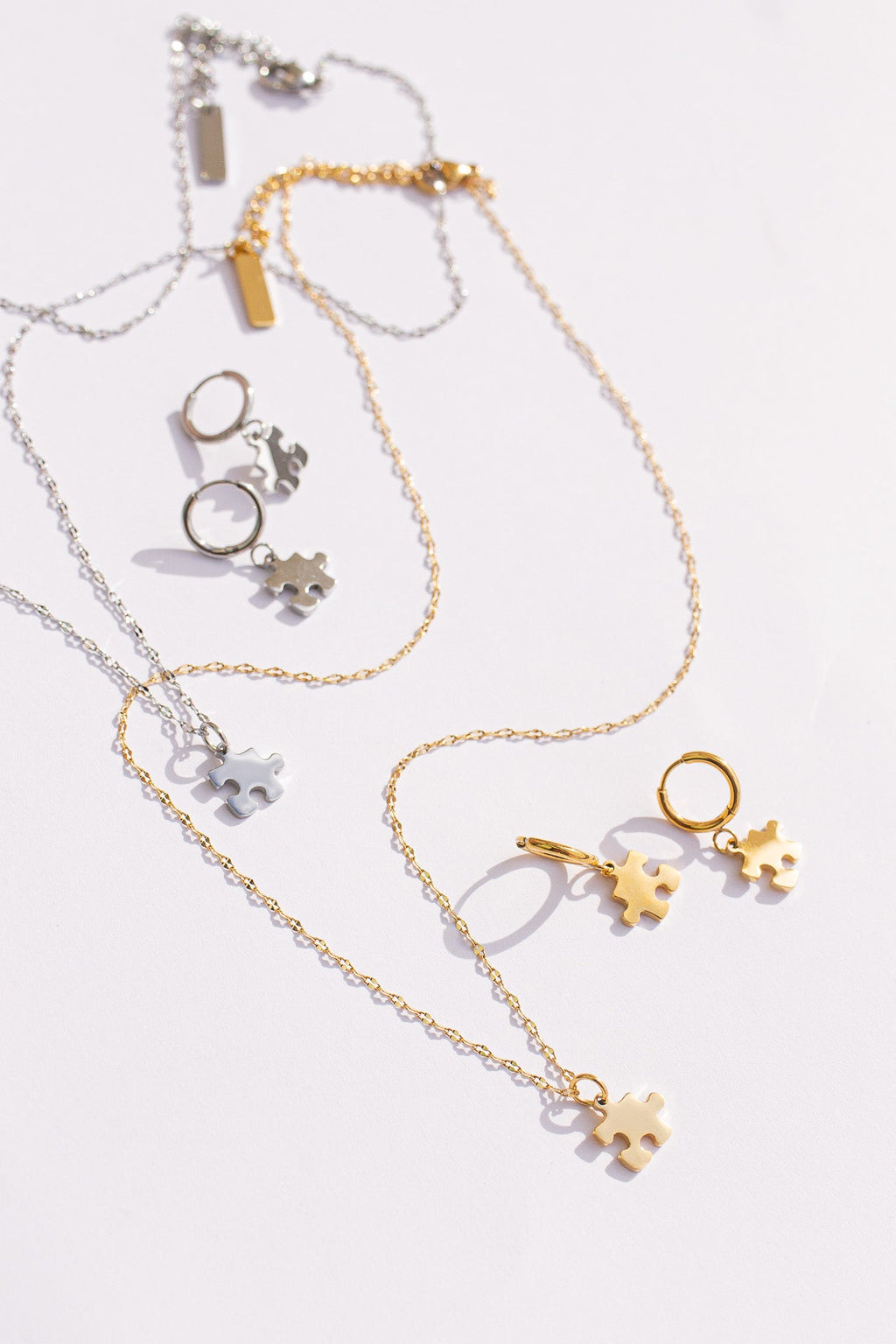 Puzzle Piece Huggie Hoops