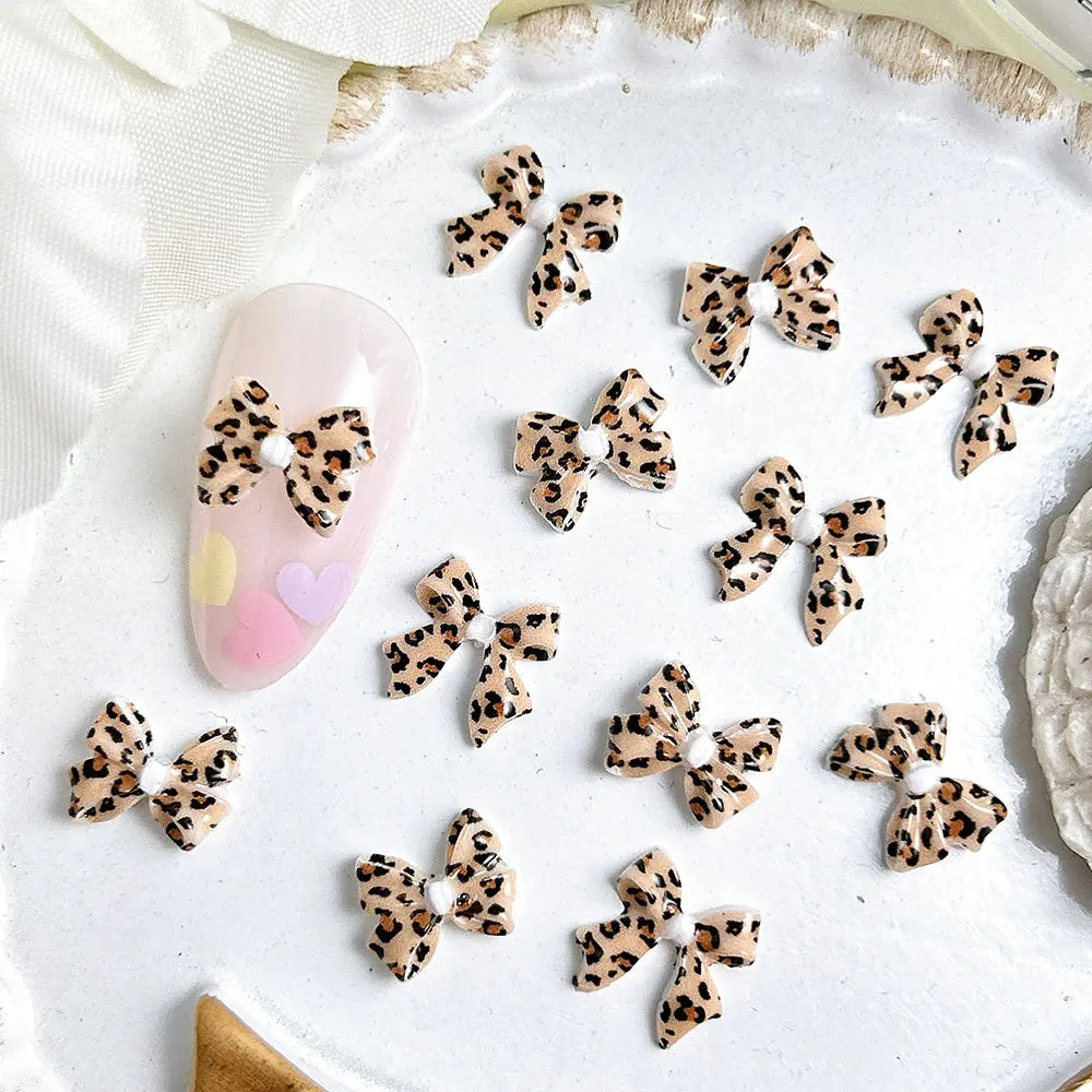 50pcs Leopard Print Bow Nail Art Decorations 10mm 3D Resin Leopard Ribbon Nail Charms Leopard Designs Acrylic Nail Art Supplies